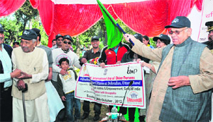 Governor Aziz Qureshi flags off a walkathon in Dehradun on Sunday. 