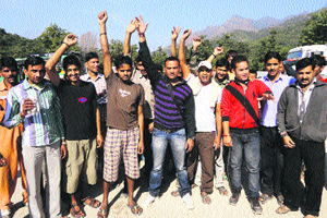  Apex workers during the protest against termination of their colleagues at Gran Morh in Reasi on Sunday. 