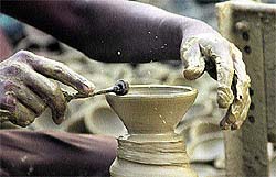 A potter working on his creations for Divali in Jalandhar on Sunday