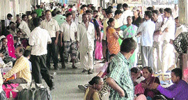 Harried passengers wait to board their respective trains at the Ludhiana railway station on Sunday.