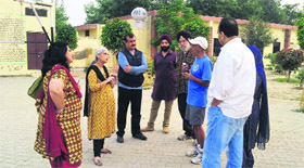 Members of city-based NGOs at Chakar village on Sunday.