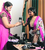 Jewellery designer Alka Kumar (right) shows her designes to a women during an exhibition in Ludhiana on Sunday.