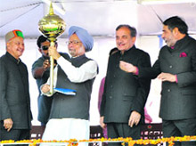 Prime Minister Manmohan Singh being honoured with a gurj by HPCC president Virbhadra Singh at a rally in Una on Sunday.