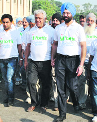 Veteran actor Om Puri takes part in Walkathon, an event organised by Fortis Hospital to create awareness about the prevention and cure of osteoporosis, in Patiala on Sunday.