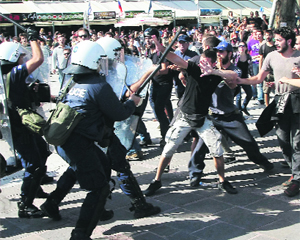 Policemen try to stop protesters from going through their cordon during a parade marking an anniversary of the Ochi (No) Day on the island of Crete. Greeks mark the annual Ochi (No) Day on October 28, which commemorates Greeces rejection of Italy's ultimatum to surrender during the Second World War.