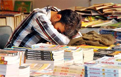 A book seller steals forty winks while waiting for customers at the book fair organised by National Book Trust at the Punjabi University Regional Centre on Monday. 