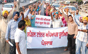 Special trainer teachers take out a protest march in the city on Monday