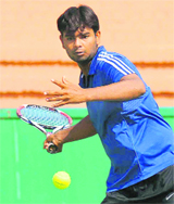 Mandeep in action during a tennis match at the CLTA, Sector 10, in Chandigarh on Monday.