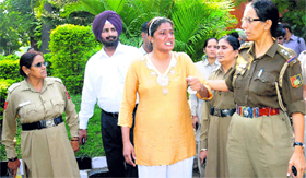 Jagjeet Kaur being taken to the Sector 26 police station from a club at Sector 27, Chandigarh, on Monday.