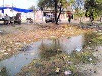 Stagnant water in front of houses and shops at Shanti Nagar in Kurukshetra. 