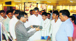 Experts show nuclear fuel to Gorakhpur farmers in nuclear power plant at Narora Atomic Power Station. A Tribune photograph