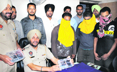 Three members of a looters gang in police custody in Jalandhar on Monday.