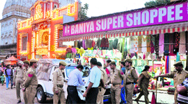 Officials of the legal metrology department and local police conduct a raid on a business establishment in Jammu on Monday.