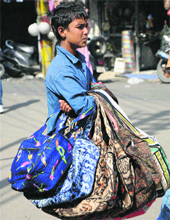 peddling articles and begging .