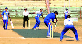Players in action during a cricket match of the 10th ESIC zonal-level sports meet championship at MA Stadium in Jammu on Monday.