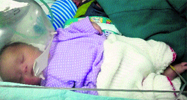 Two infants share a ventilator in the special care unit for children at GB Pant Hospital in Srinagar.