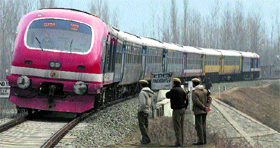 CRPF personnel stand guard near a railway track at Nowgam, 12 km from Srinagar.