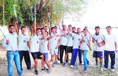  Players of the hockey team of GNDU College, Narot Jaimal, in a joyous mood after getting permission to participate in the inter-college hockey tournament in Amritsar on Tuesday. 