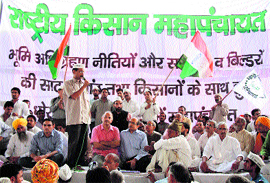 Anti-corruption activist Arvind Kejriwal addresses a mahapanchayat on land scams in Haryana at Manesar, near Gurgaon, on Tuesday.