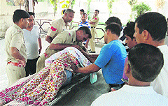 Police personnel inspect Shwetas body at Modal Town in Karnal on Tuesday.  