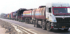 A long queue of vehicles stranded on the national highway at Rukhi village on Tuesday.