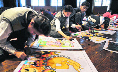 Children participate in a painting competition organised by the Himachal Pradesh police.