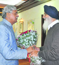 Chief Minister Parkash Singh Badal presents a bouquet of flowers to Union Coal Minister Sriprakash Jaiswal in Delhi on Tuesday. 
