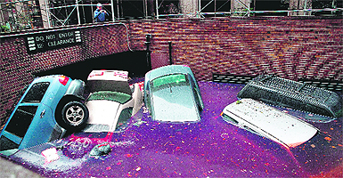 Cars float in a flooded basement following Hurricane Sandy in New York. 