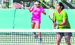 Tarranum returns a shot in a doubles match during the ongoing CLTA-AITA Mens and Womens Tennis Tournament at the CLTA, Sector 10, in Chandigarh on Wednesday. tribune photo: s chandan