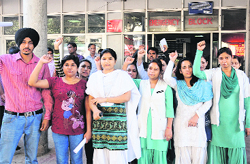 Nurses stage a protest at the GMCH in Sector 16, Chandigarh, on Wednesday. tribune photo: Manoj Mahajan