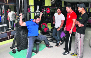 Players sweat it out at a private fitness club in Jammu. 