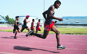 Athletes take part in a 400m race during the trials for the Punjab State Rural Games at Guru Nanak Stadium in Ludhiana on Wednesday. 