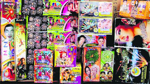 Firecrackers with pictures of Bollywood and Hollywood actors displayed at the cracker market in Ludhiana.
