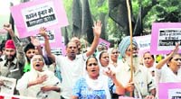 Survivors of the 1984 anti-Sikh riots, relatives and supporters hold a march near Parliament in New Delhi on Wednesday