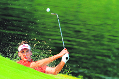 Ian Poulter plays from a bunker during the WGC HSBC Champions Pro-Am in Dongguan on Wednesday.