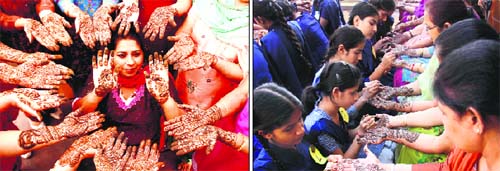Women get henna applied on their hands on the eve of Karva Chauth in Amritsar on Thursday. 