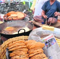 Eatables being deep fried at a shop in Amritsar.