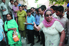 Councillor Rajinder Kaur Brar (right) makes her point at the school in Guru Ki Nagri. 