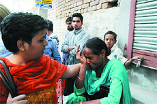 The teacher who was slapped by the councillor being consoled.