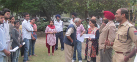 ASP Patil Ketan Baliram (right) briefs the students about the traffic rules and regulations on Thursday.