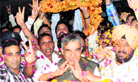 Railway Minister Pawan Kumar Bansal gets a rousing welcome at the Chandigarh airport on Thursday.