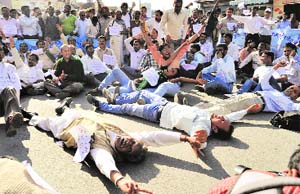 SC/ST employees of the state government hold a demonstration in support of their demands in Dehradun on Thursday.