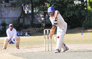 A batsman plays a shot in a match in the Youth Cup Cricket Tournament in Dehradun on Thursday. 