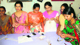 Ria Sisodia (extreme right), an expert in artificial jewellery designing, provides training to students at MM PG College at Fatehabad.
