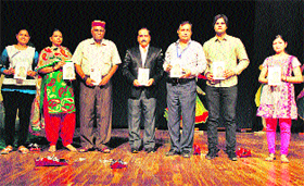 Sunil Mutreja (second from right), Executive Director, Amar Ujala Group, Noida, releases Sanskriti Ke Prahari, a book on the life sketch of Anoop Lather (extreme right), Director, Youth and Cultural Affairs, Kurukshetra University.