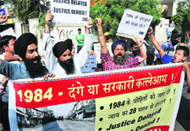 Sikhs from various organisations along with members of the Jan Jagriti Manch stage a protest in Jammu on Thursday. 