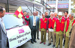 The Chief Postmaster General, Jammu and Kashmir, launches the evening parcel delivery service in Srinagar on Thursday. Tribune photo: Amin War