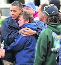US President Barack Obama comforts a citizen affected by superstorm Sandy on Wednesday in Brigantine