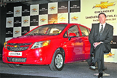 General Motors India president & MD Lowell Paddock poses with the Chevrolet Sail U-VA premium hatchback at its launch in New Delhi on Friday. The car, available in petrol and diesel variants, is priced from Rs 4.44 lakh.