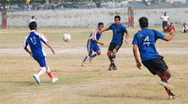 A football match in progress at the railway ground in Bathinda where a sporting event is underway. 